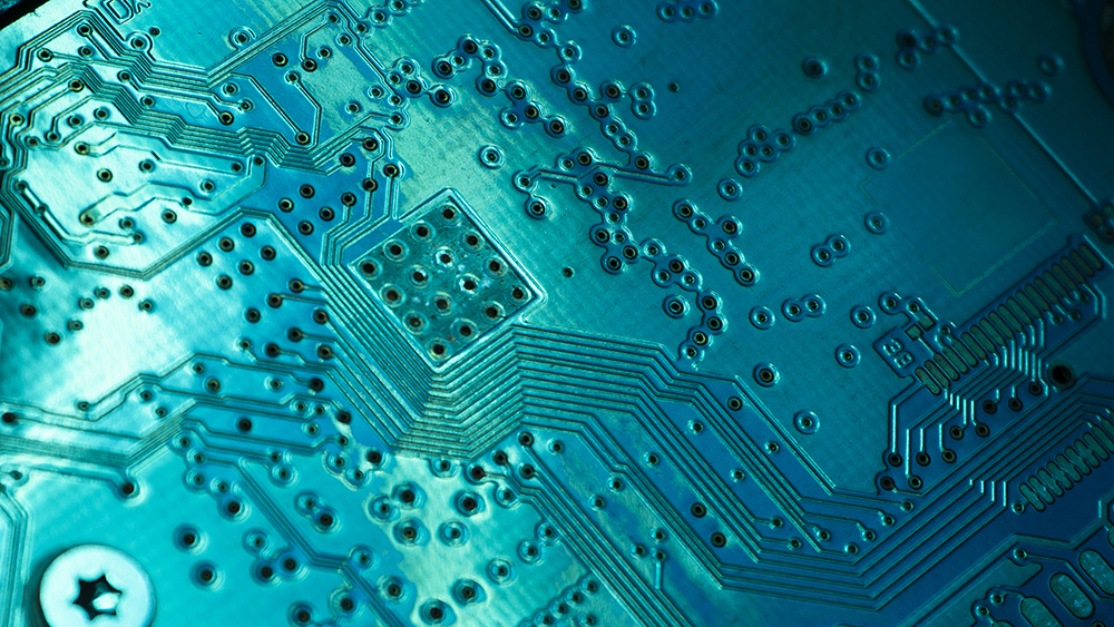 Close-up of electronic circuit computer microchips in neon color