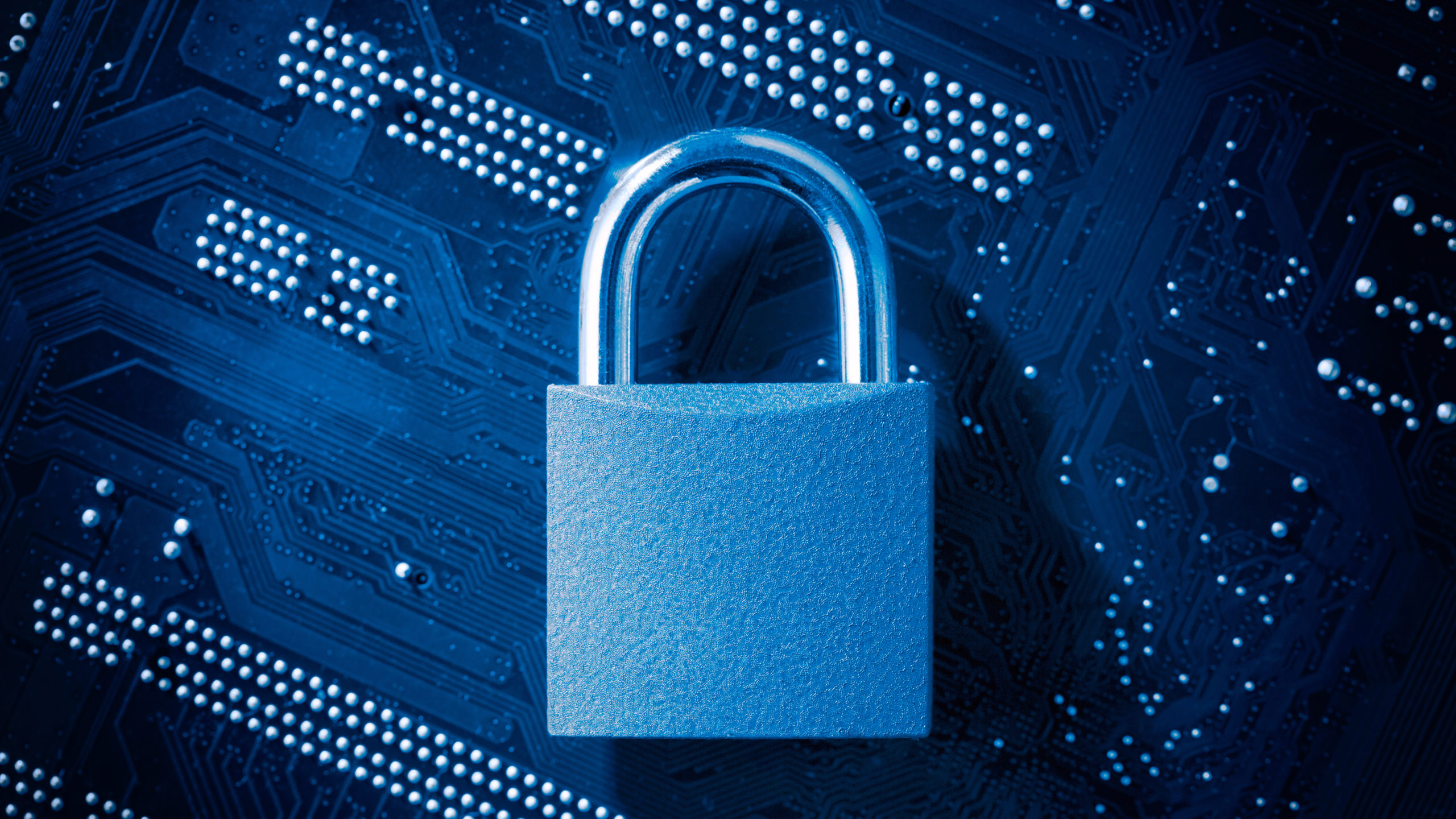 Padlock on computer motherboard. Internet data privacy information security concept.